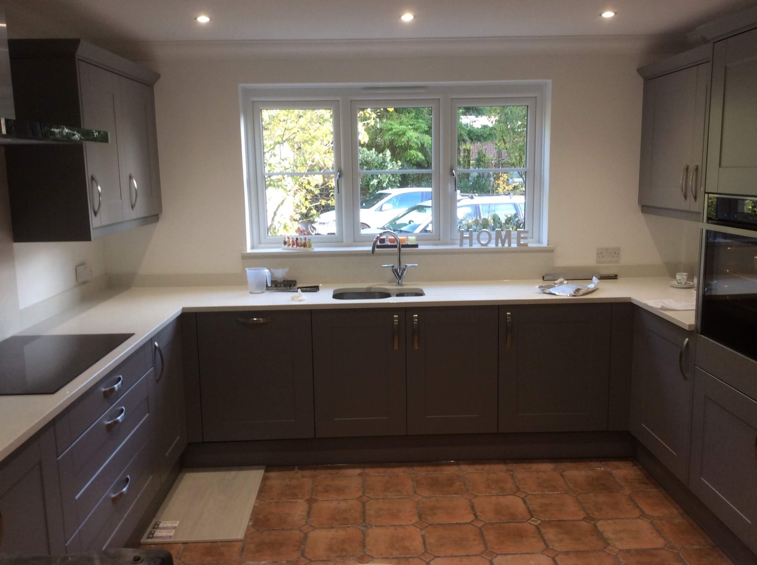 Dark Grey kitchen with silver handles