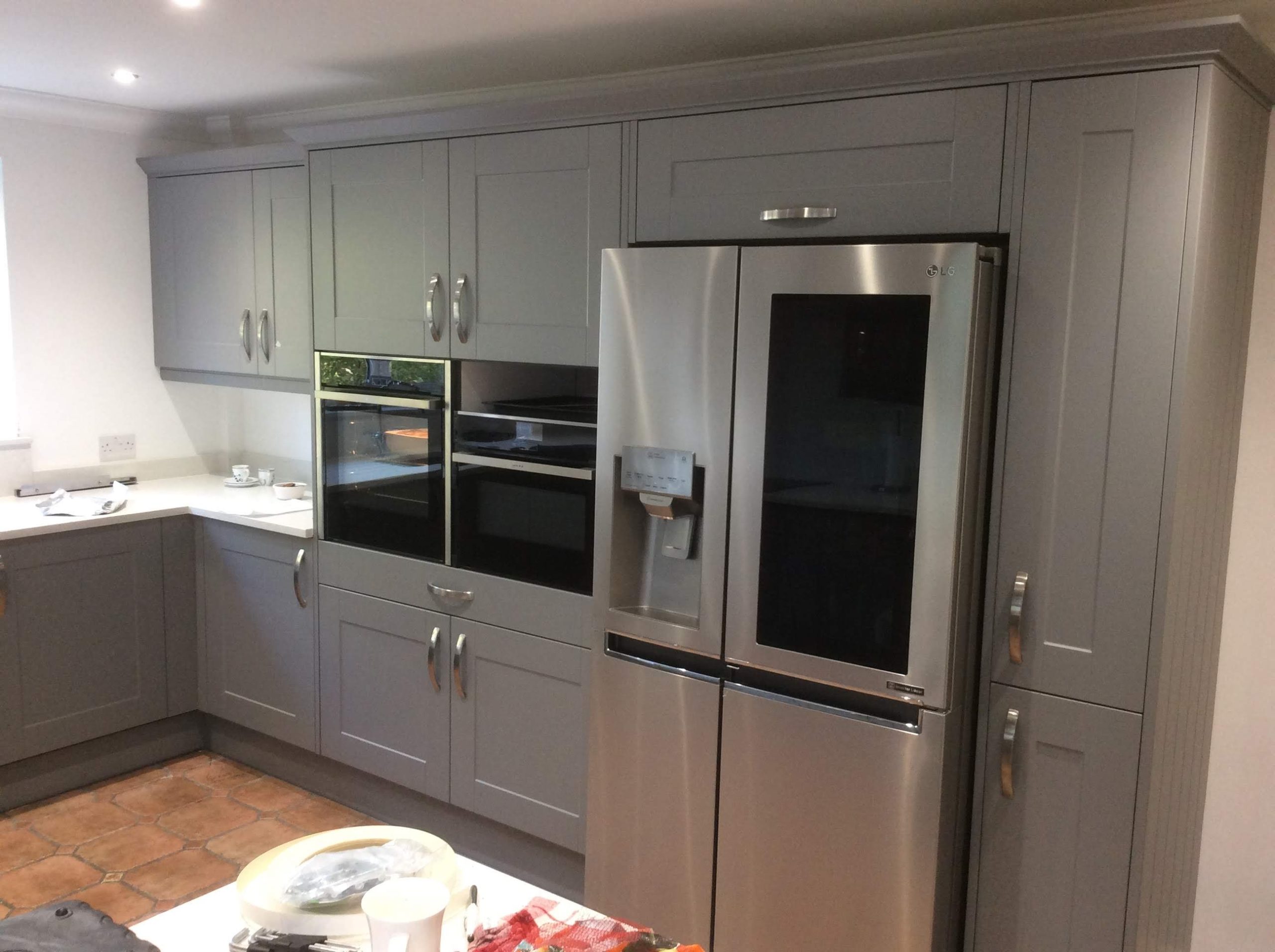 Light Grey kitchen units with silver handles