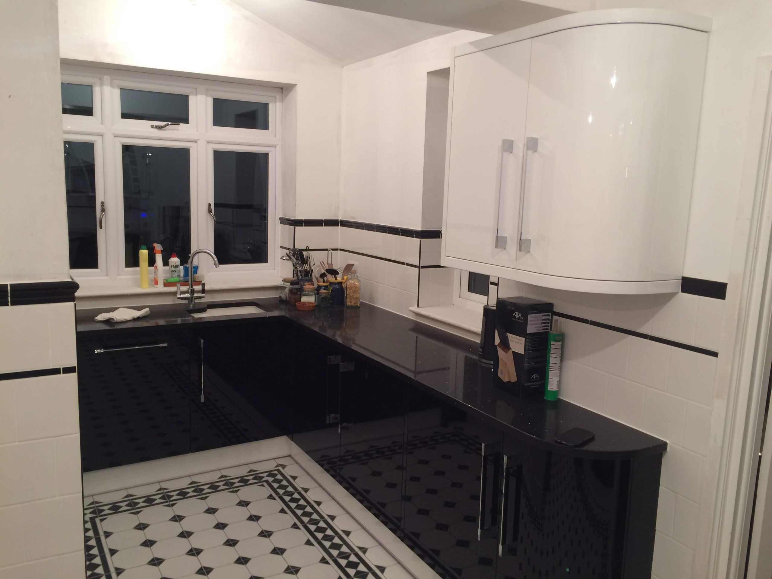 Two colour kitchen - White curved kitchen wall units with black base units