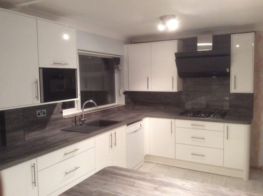 Cream kitchen with matching ash worktops and wall panels