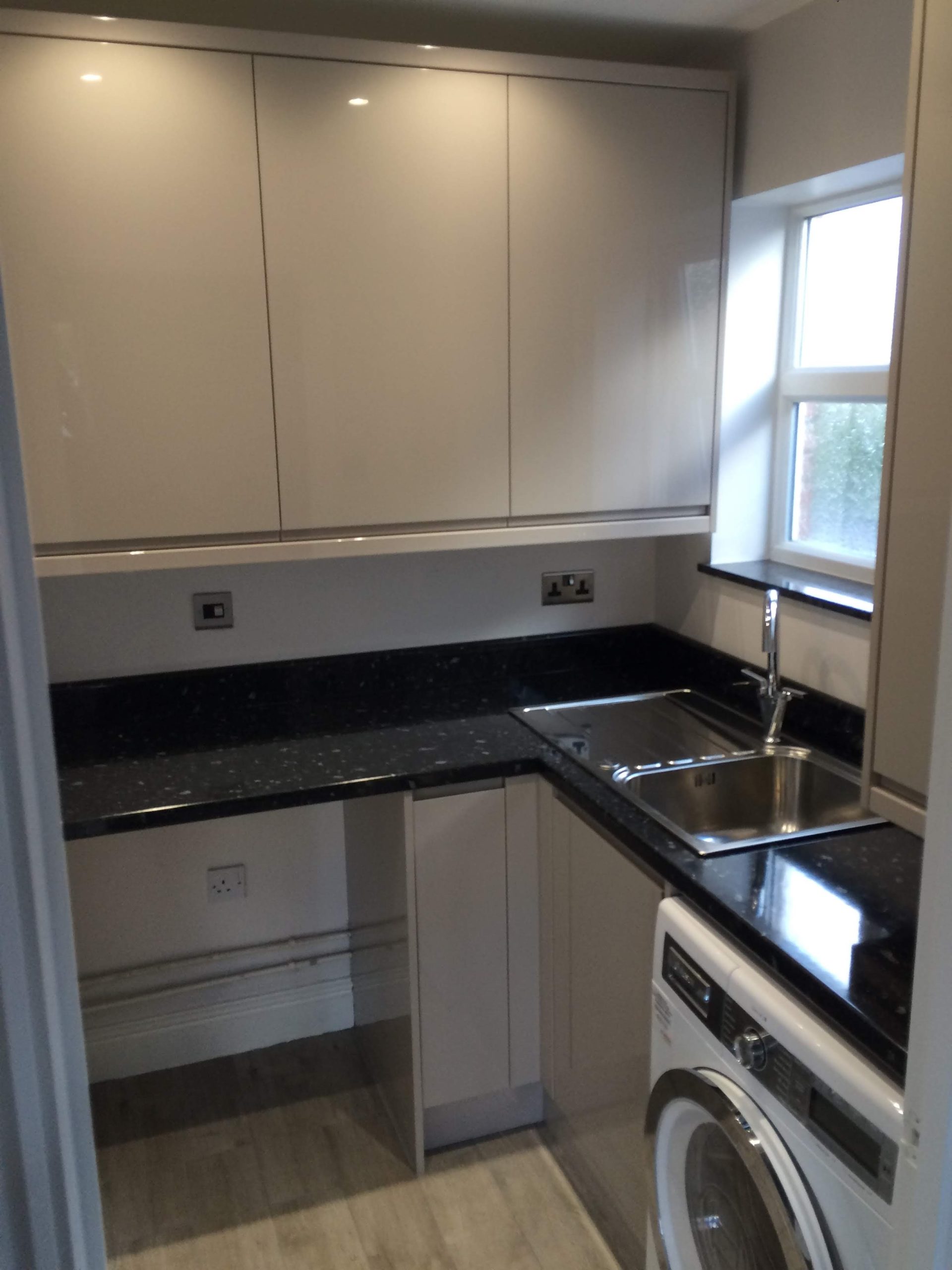 Compact Grey Gloss kitchen with sparkly black worktops