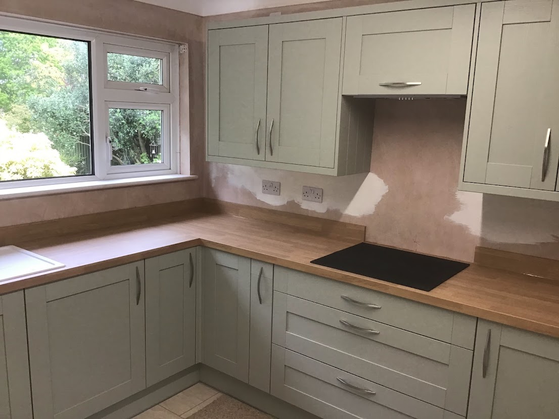 Induction hob in olive kitchen