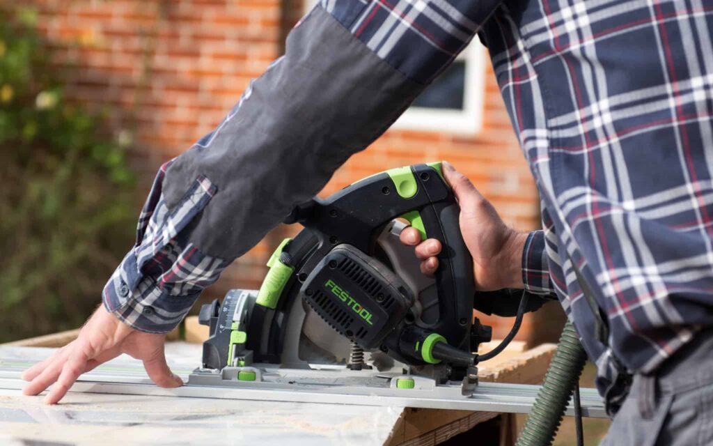 Carpenter cutting wood