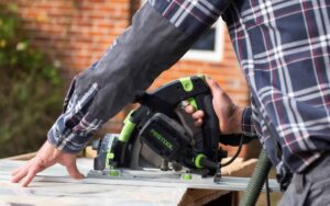 Carpenter cutting wood