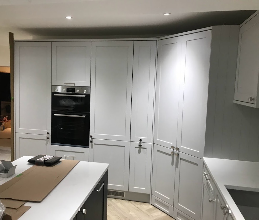 Angled Corner units in light grey kitchen